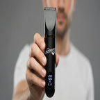 Person holding a black grooming trimmer with 'Alpenbart' branding against a gray background