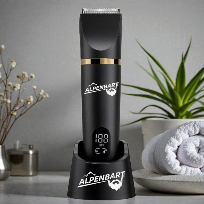 Black Alpenbart beard trimmer on a stand with a plant and towel in the background
